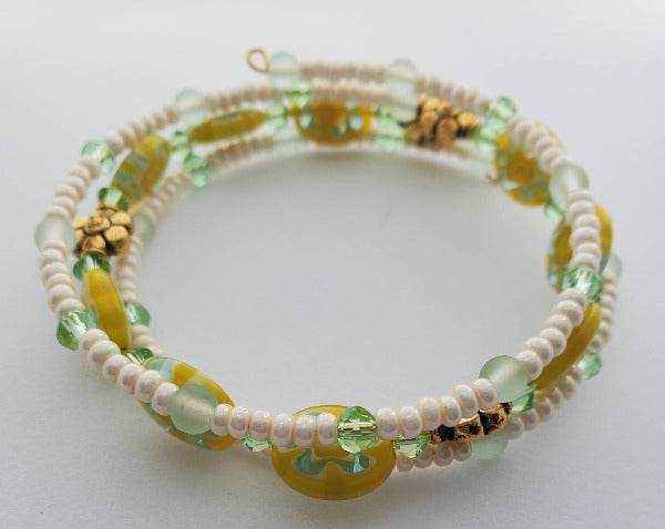 Yellow Daisy Cuff Millefiori Bracelet with aqua beads and floral accents on memory wire cuff