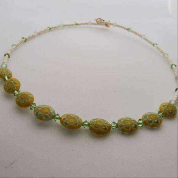 Yellow daisy millefiori floral necklace with green glass beads and lobster clasp