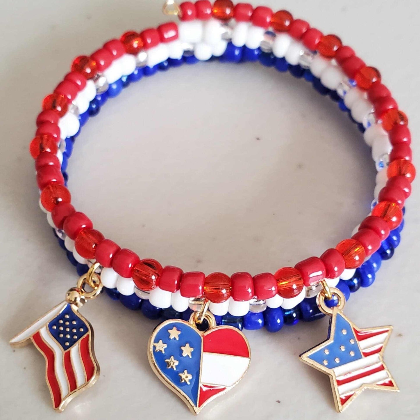 Red White and Blue Charm Bracelet with Czech glass beads and brass flag, heart, and star charms.