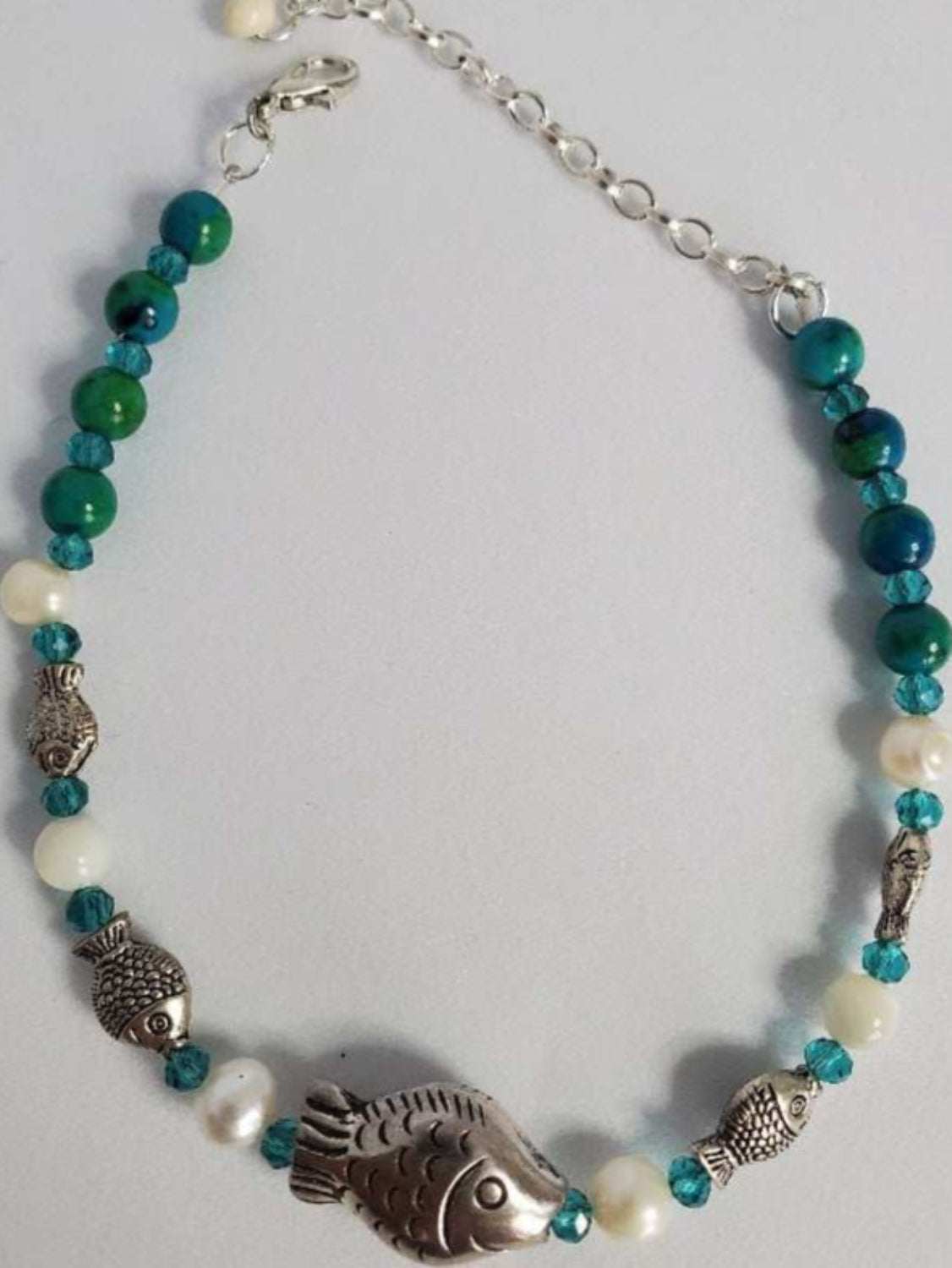 Turquoise fish ankle bracelet with black stone, freshwater pearls, shell accents, and pewter fish charms