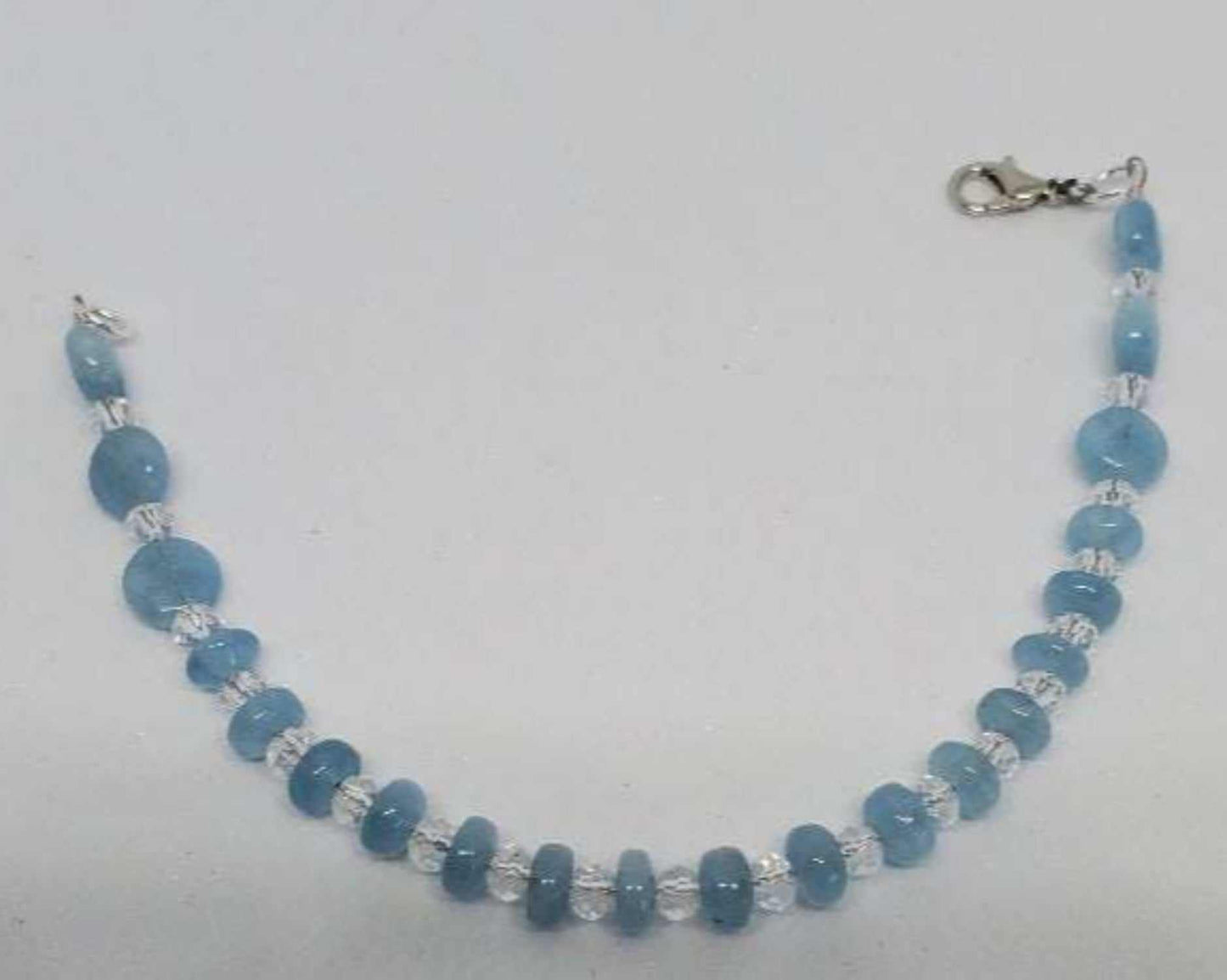 Handcrafted gemstone bracelet with aquamarine rondelles and Austrian crystal beads on a lobster clasp closure