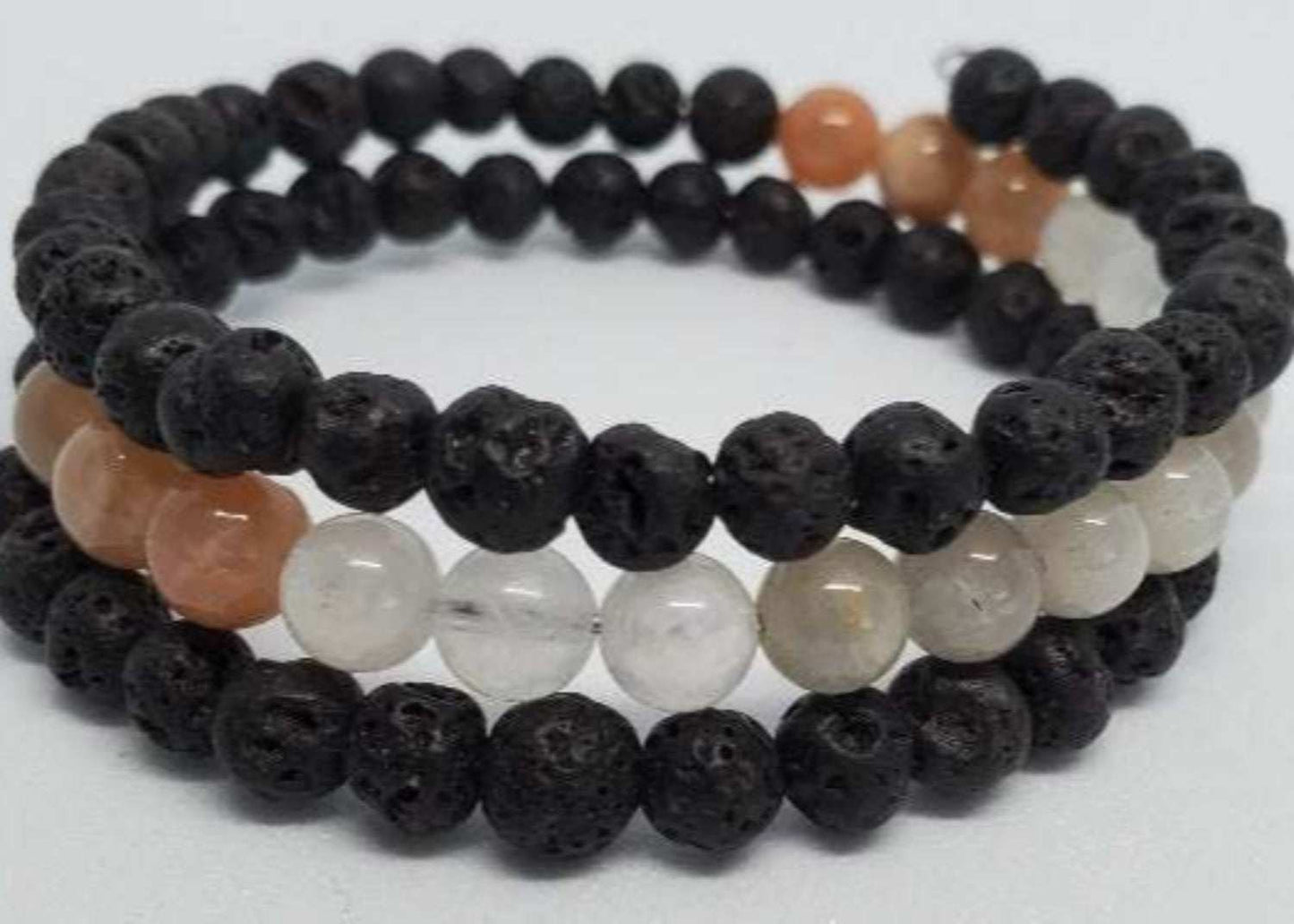 Mixed moonstone and black lava stone gemstone bracelet with memory wire cuff design