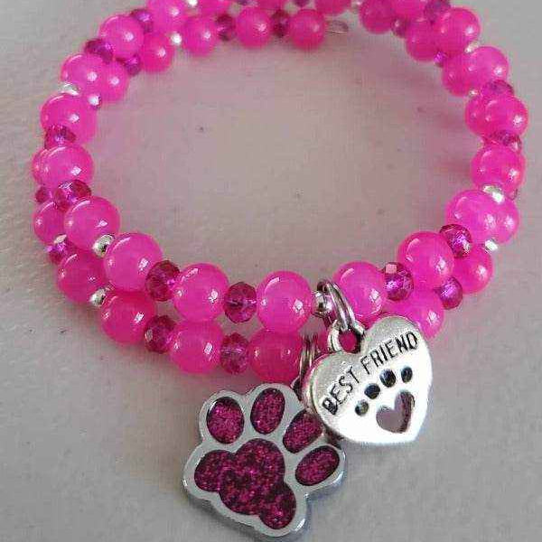 Pink charm bracelet with paw print and "Best Friend" heart charms for pet lovers