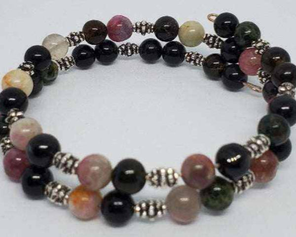 Tourmaline gemstone bracelet cuff with black and pink beads and pewter spacers, flexible memory wire design.