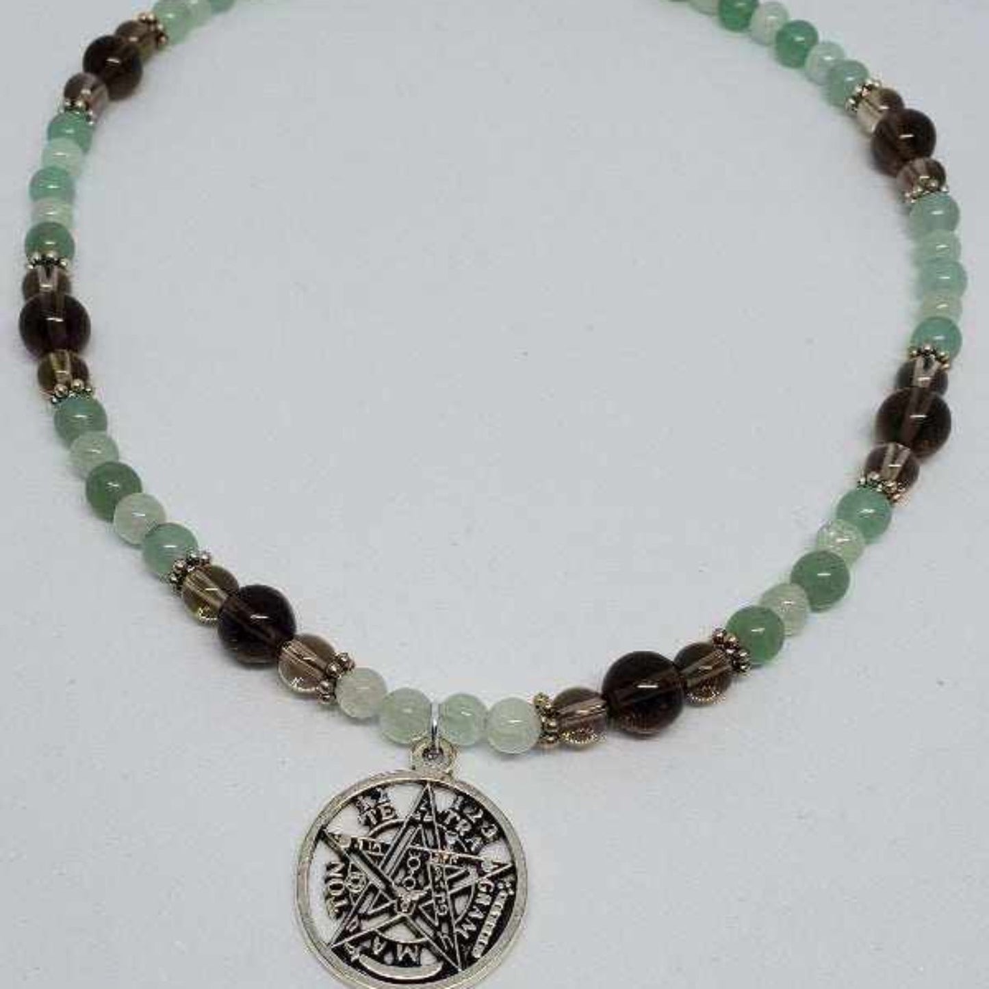 Tetragrammaton Gemstone Necklace with green and brown beads and a silver pentagram pendant