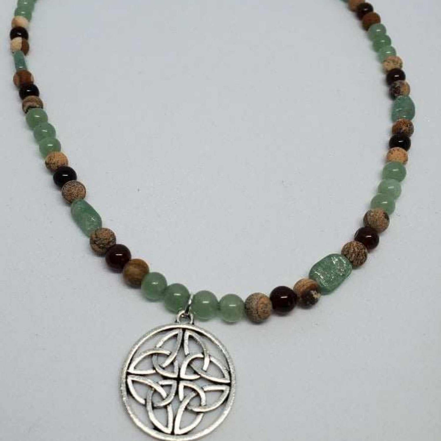 Gemstone necklace with Celtic knot pendant and mixed natural stones including Tiger's Eye, Magnesite, Aventurine, and Jasper