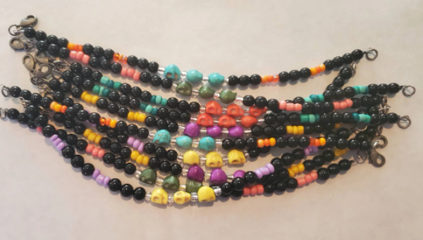 Colorful Skull Bracelet with Howlite skull beads and vibrant glass for Día de Los Muertos and Halloween style