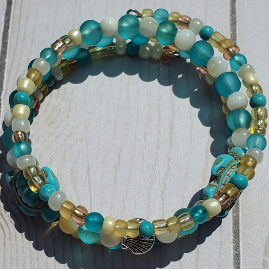 Multicolored beaded bracelet on a wooden surface