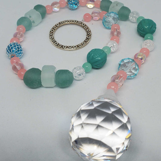 Crystal suncatcher with pink, turquoise, and clear beads and faceted prism crystal pendant on metal ring