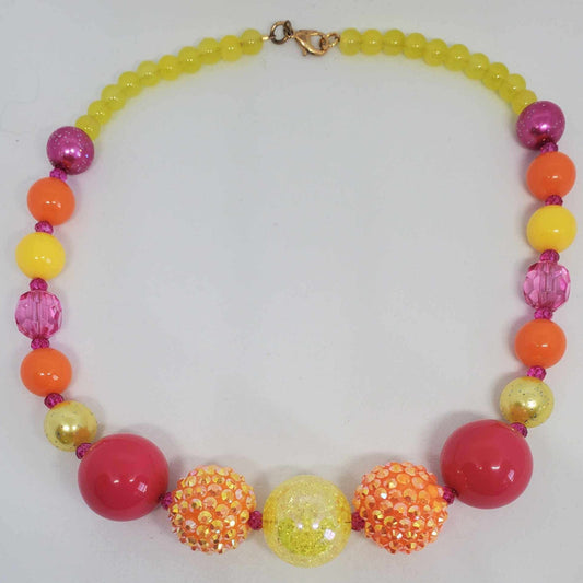 Vibrant neon beaded necklace with yellow, orange, pink, and red beads, featuring sparkling crystals for a bold summer accessory.
