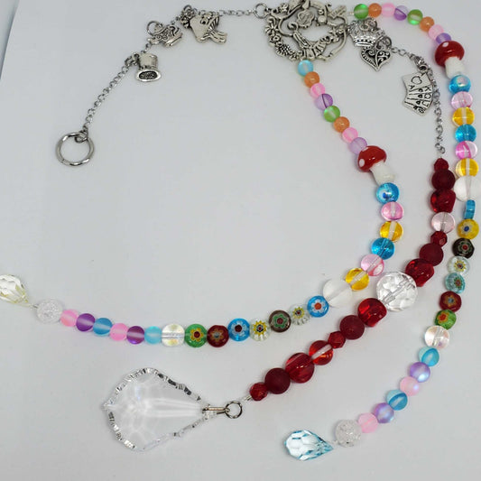 Colorful Crystal Suncatcher with pewter charms inspired by Alice in Wonderland and sparkling glass beads