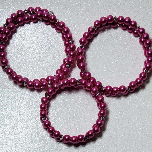 Pearl cuff bracelet set with dazzling fuchsia acrylic pearls and silver crystal beads on adjustable memory wire bands