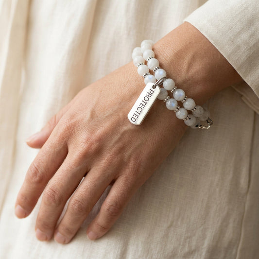Handcrafted gemstone bracelet with protective charm and adjustable memory wire band for stylish spiritual protection