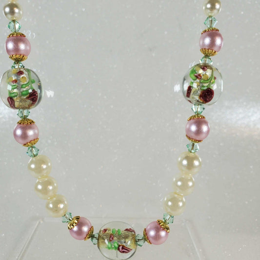 Vintage fashion necklace featuring pink rose lampwork beads, white and pink glass pearls, Austrian crystals, and brass accents