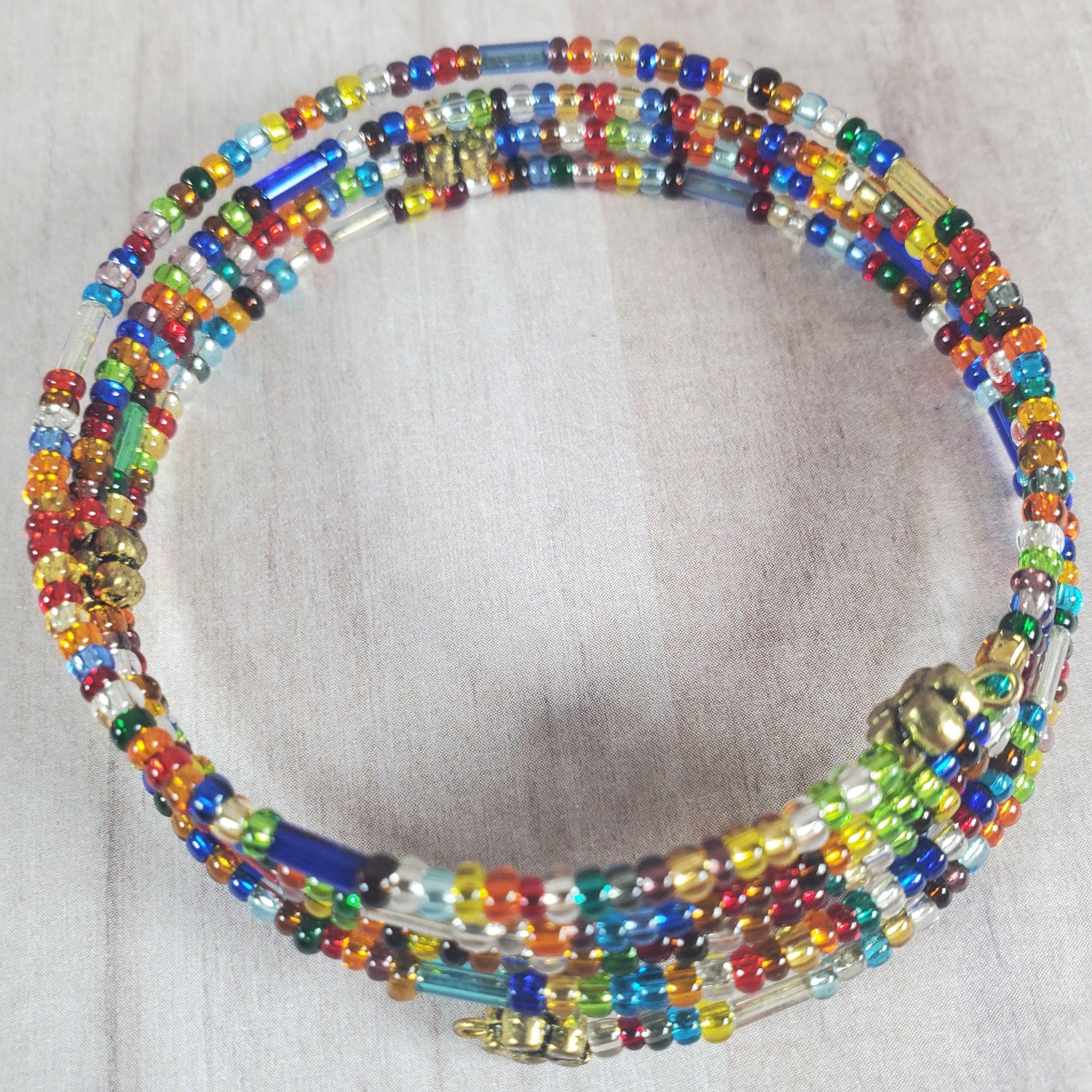 Multicolored beaded necklace on a light gray background
