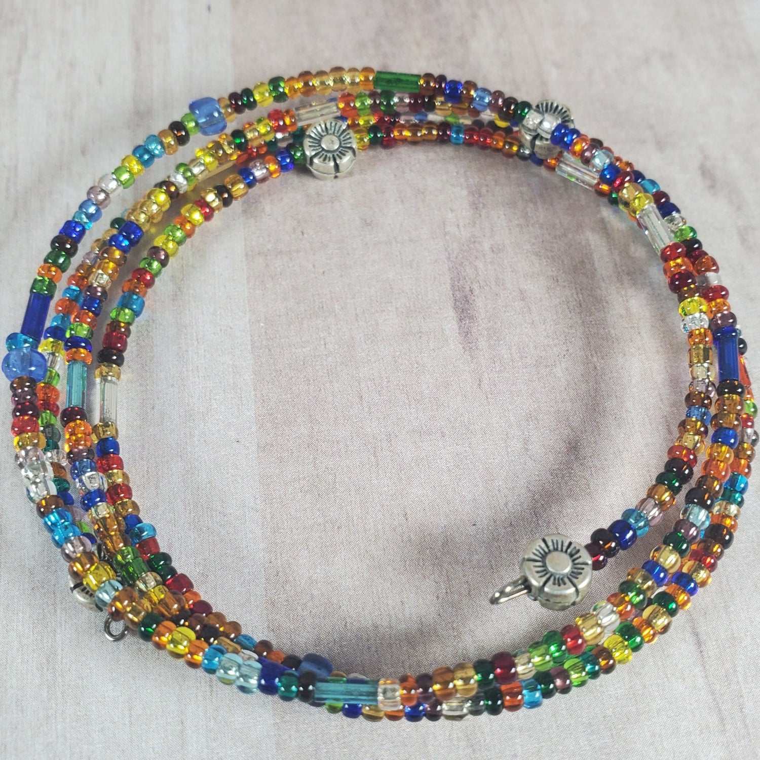 Coil Confetti Bracelet multicolored glass beads with pewter accents on memory wire cuff