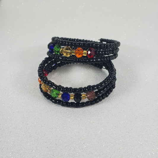 Multicolored beaded bracelet on a light gray background