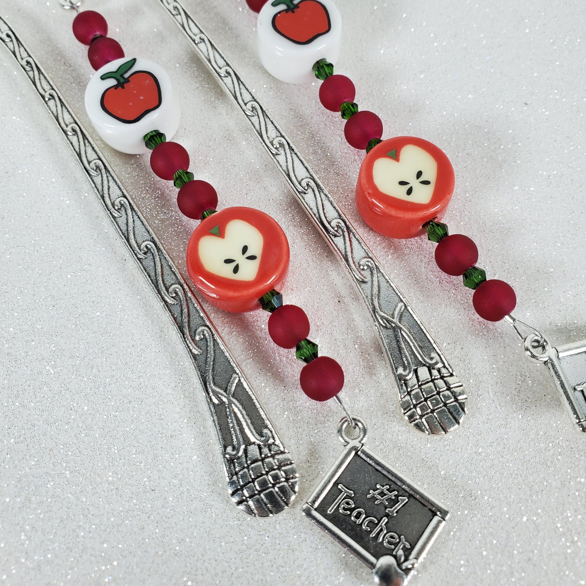 Teacher-themed bookmark with apple design on a light gray background