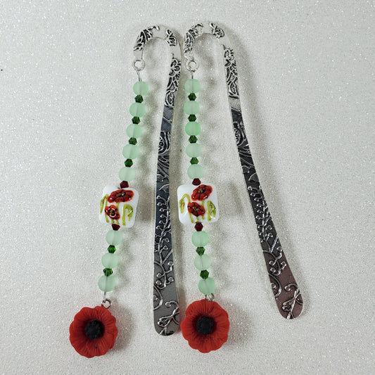 Two decorative bookmarks with floral designs on a light gray background