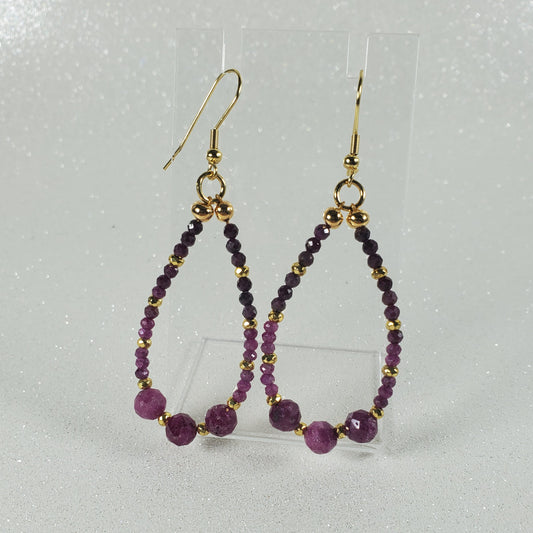 Beaded earrings with Ruby beads on a gray background