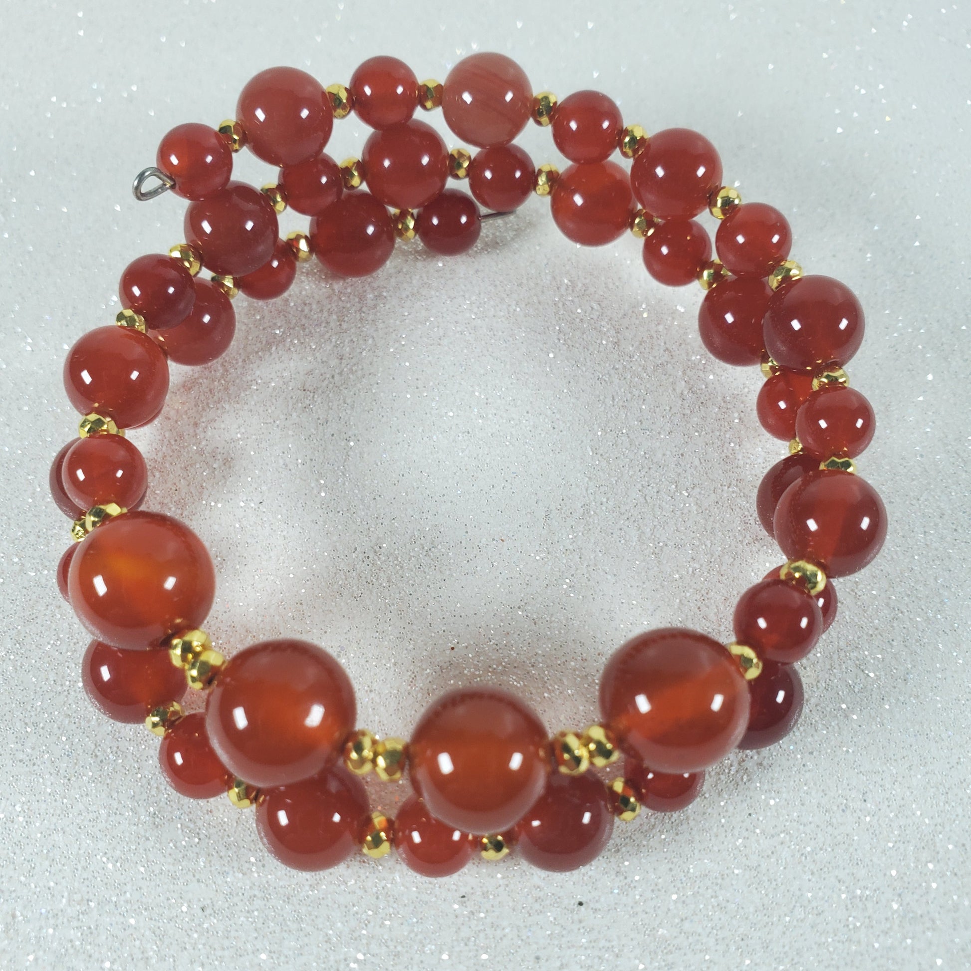 Red beaded bracelet on a white background