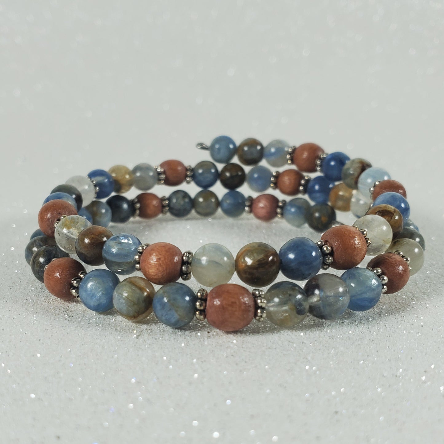 Multicolored beaded bracelet on a light gray background