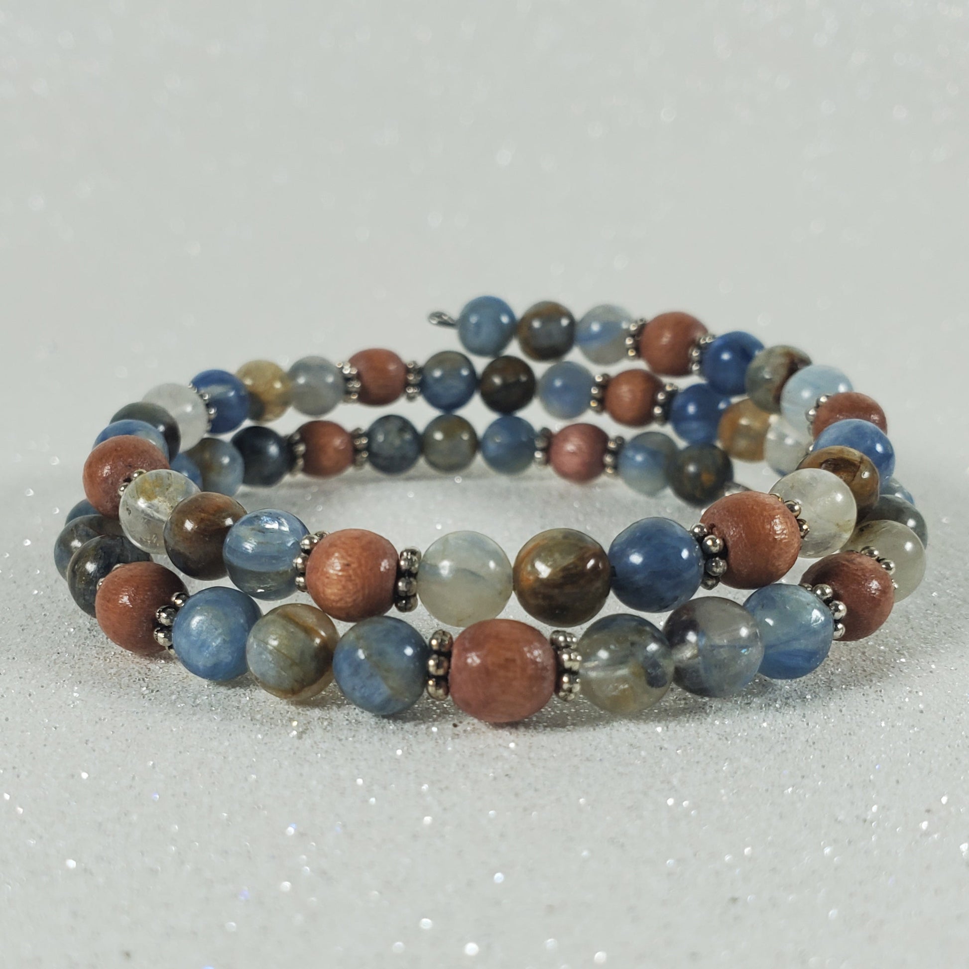Multicolored beaded bracelet on a light gray background