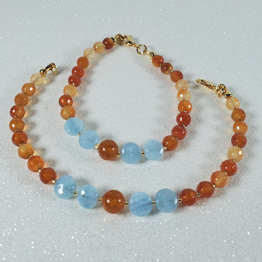 Two beaded bracelets on a light gray background