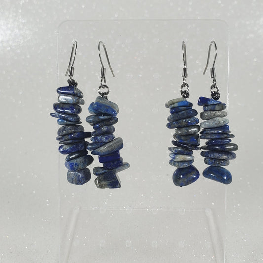 Pair of blue beaded earrings on a white background
