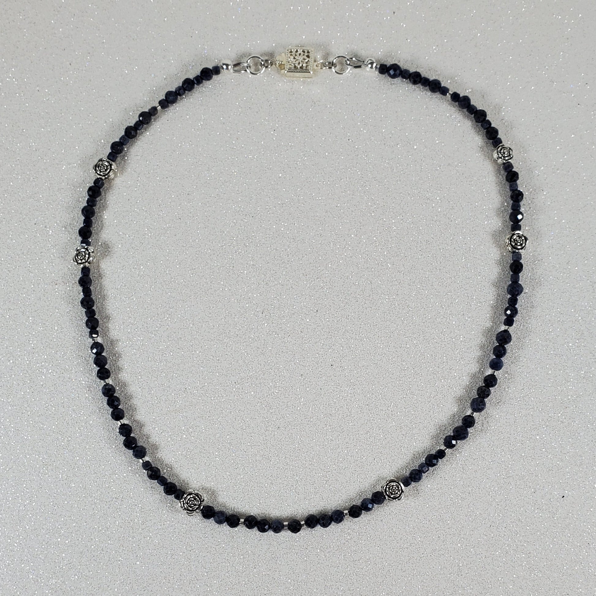 Beaded necklace on a light gray background