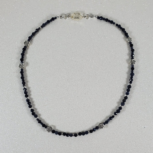 Beaded necklace on a light gray background
