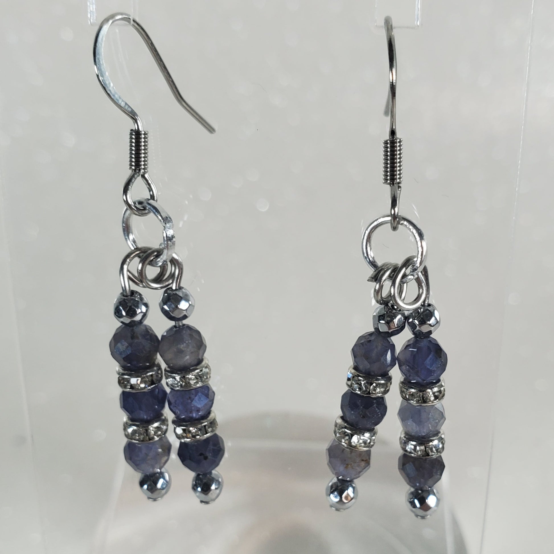 Pair of beaded earrings on a white background