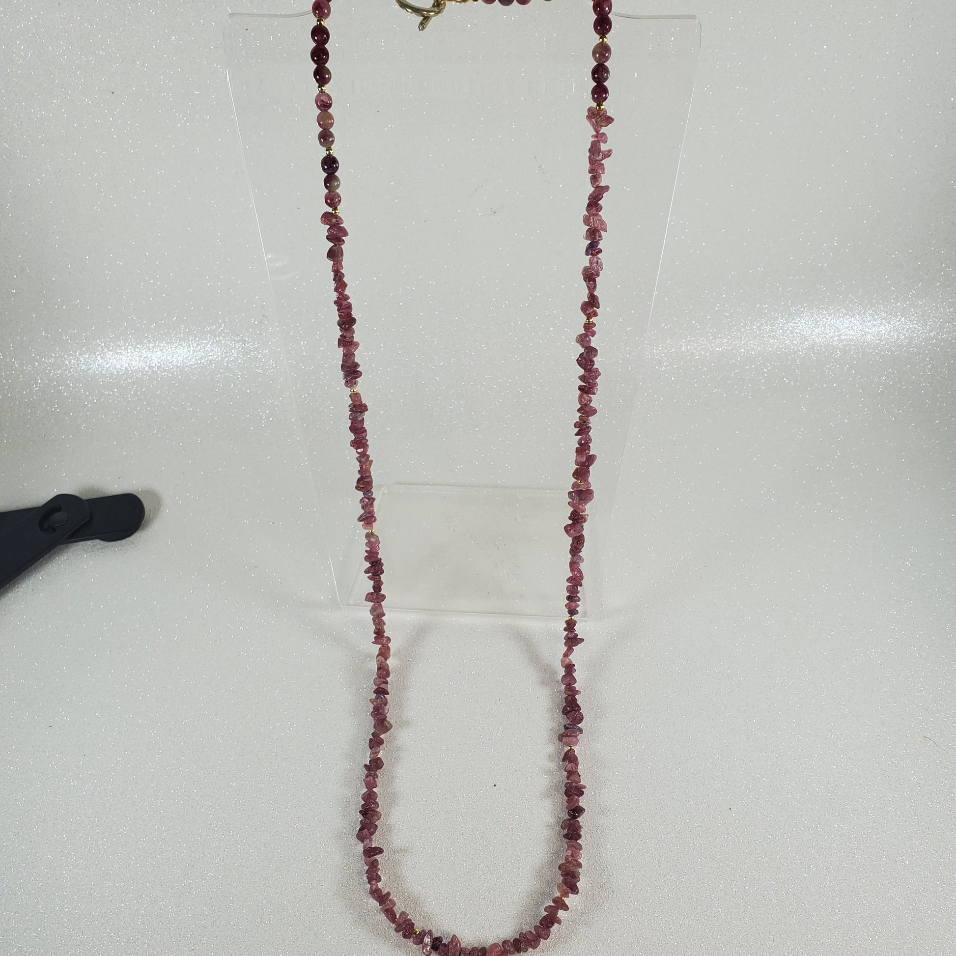Beaded necklace on a white surface