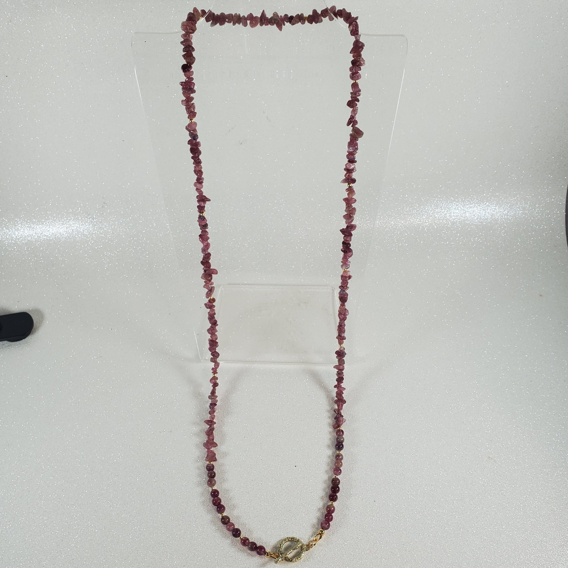 Beaded necklace on a white surface