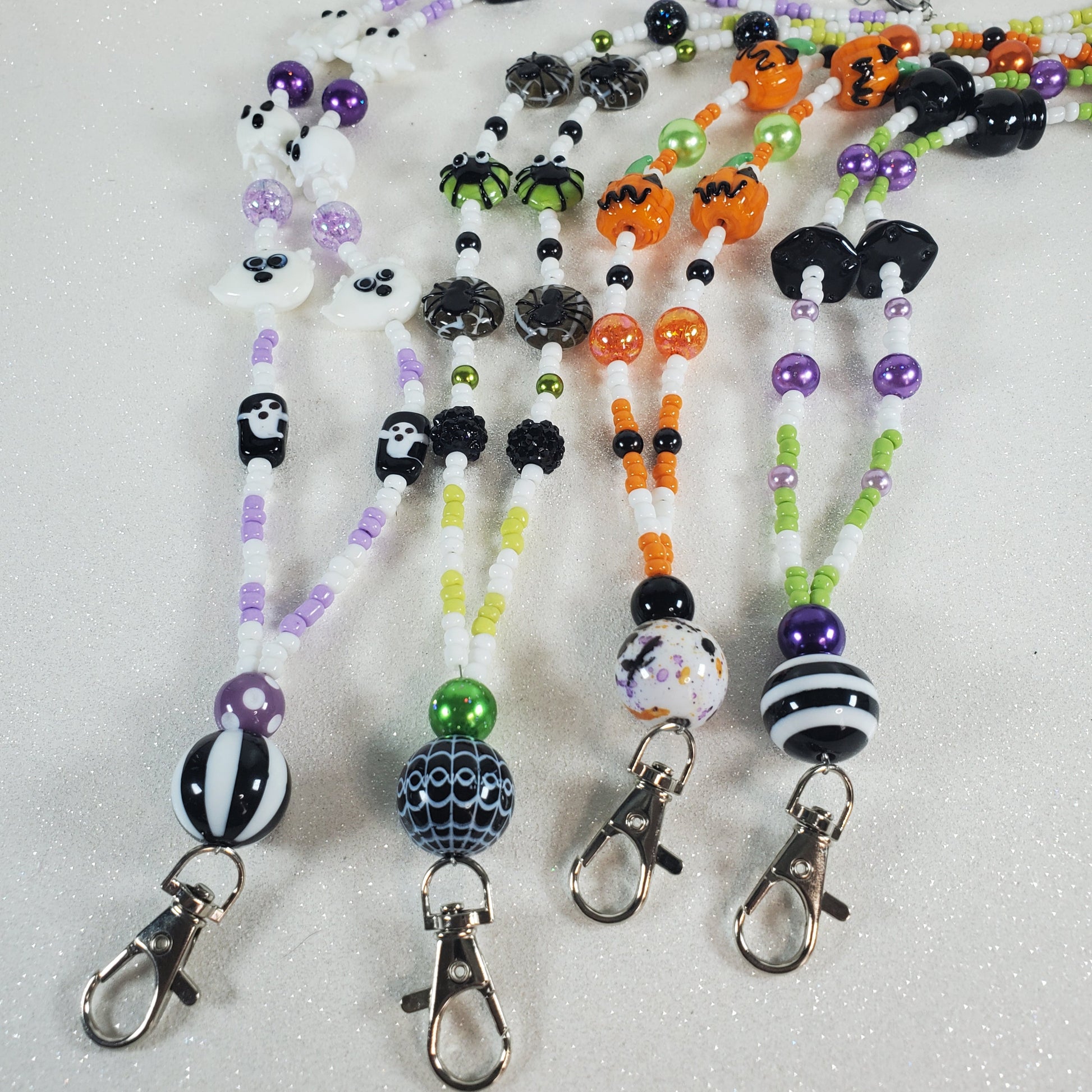 Set of Halloween-themed beaded lanyards on a white background
