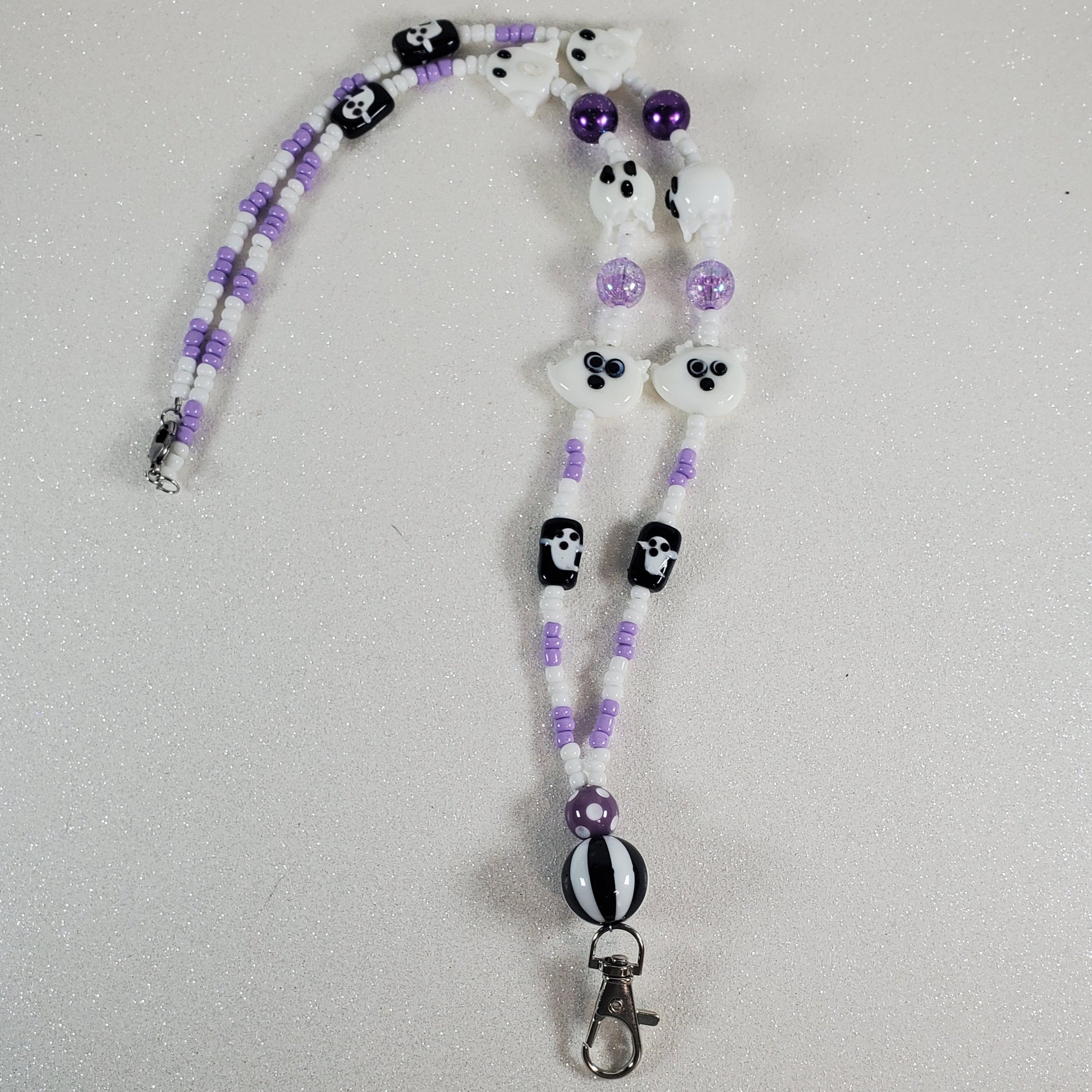 Beaded lanyard with ghost design on a light gray background