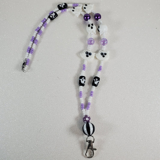 Beaded lanyard with ghost design on a light gray background