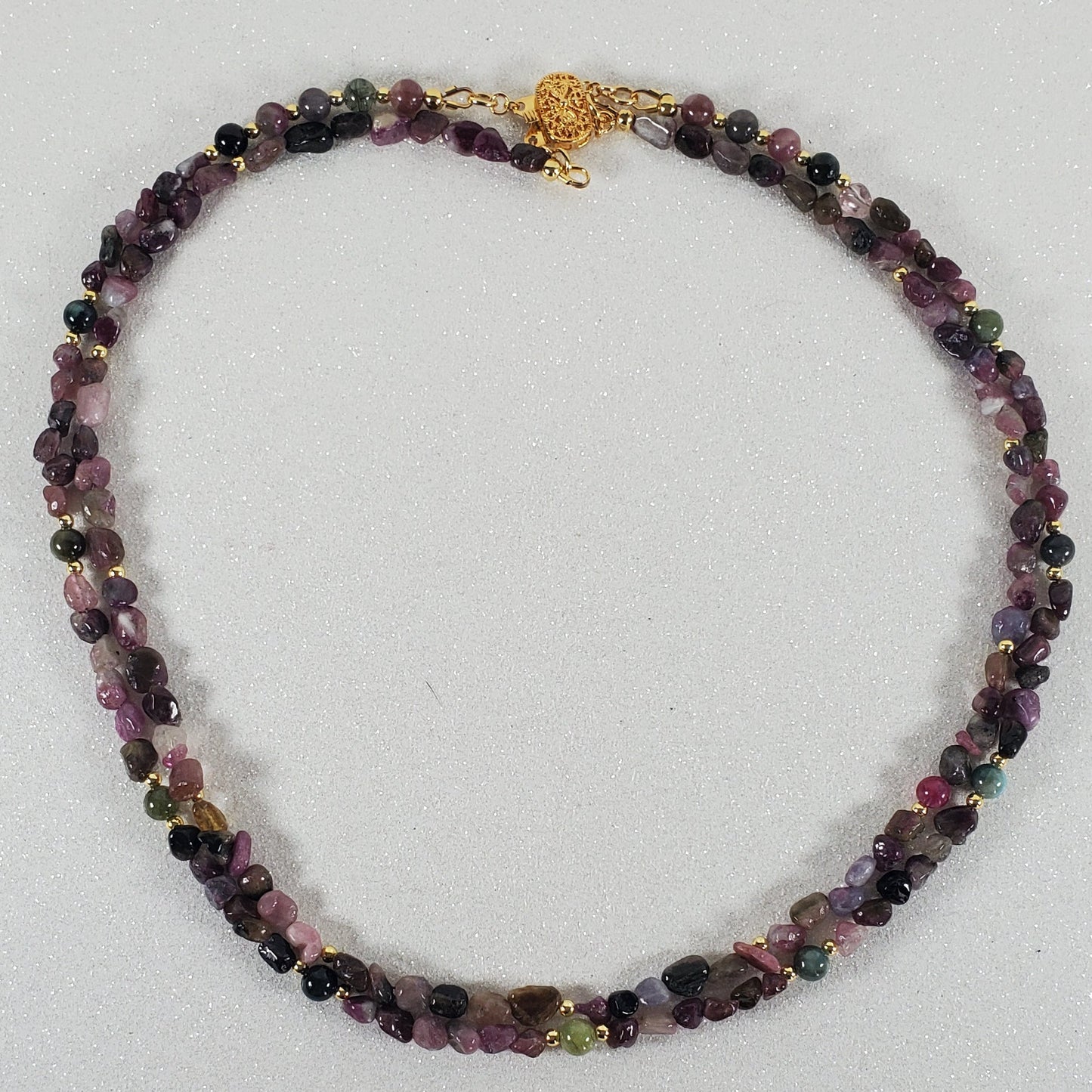 Multicolored beaded necklace on a white background