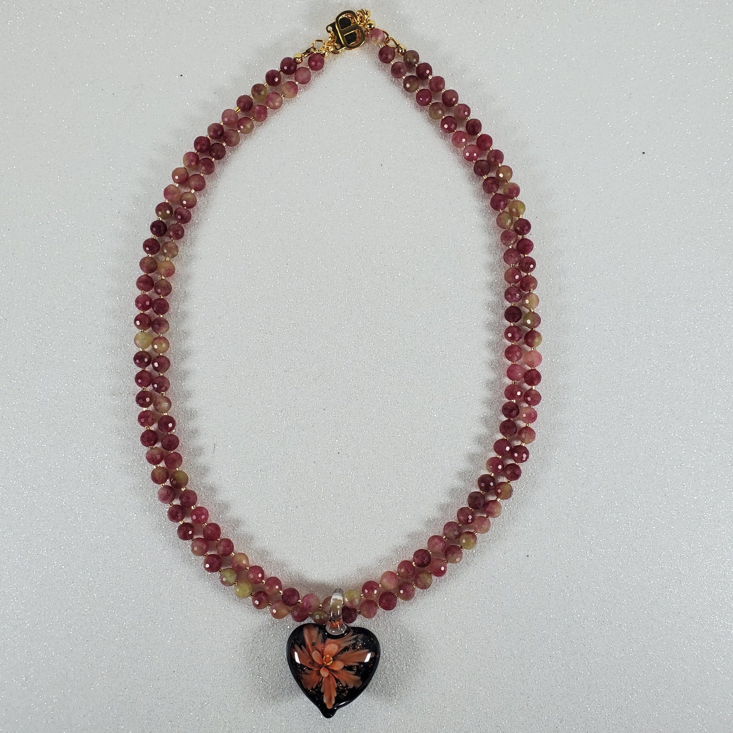 Beaded bracelet with a box clasp on a white background