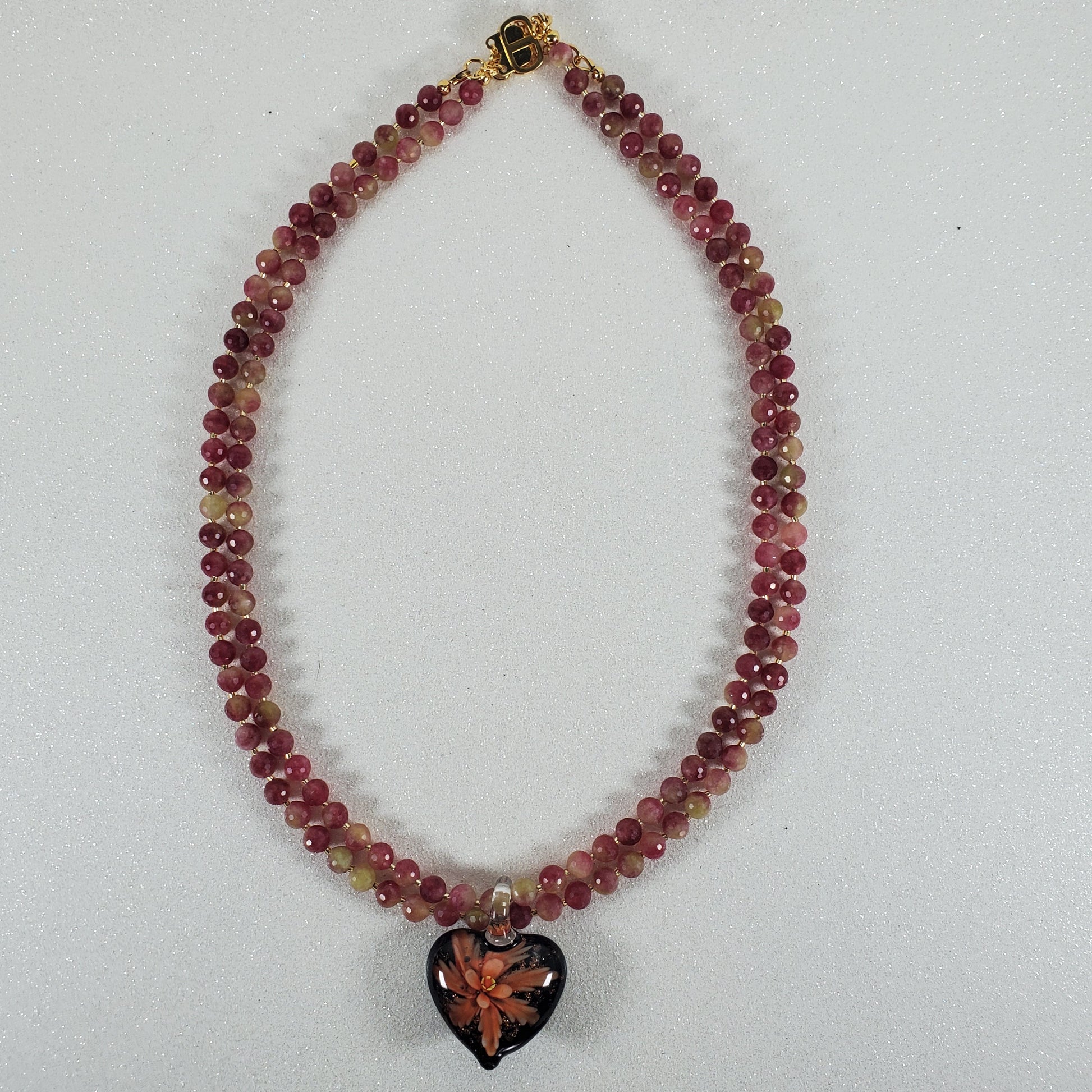 Beaded bracelet with a box clasp on a white background