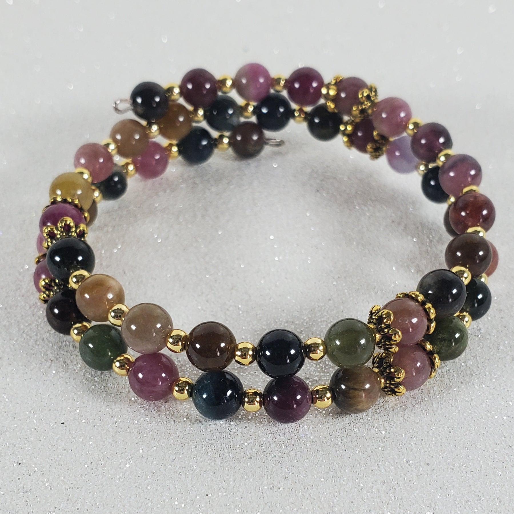 Multicolored beaded bracelet on a light gray background