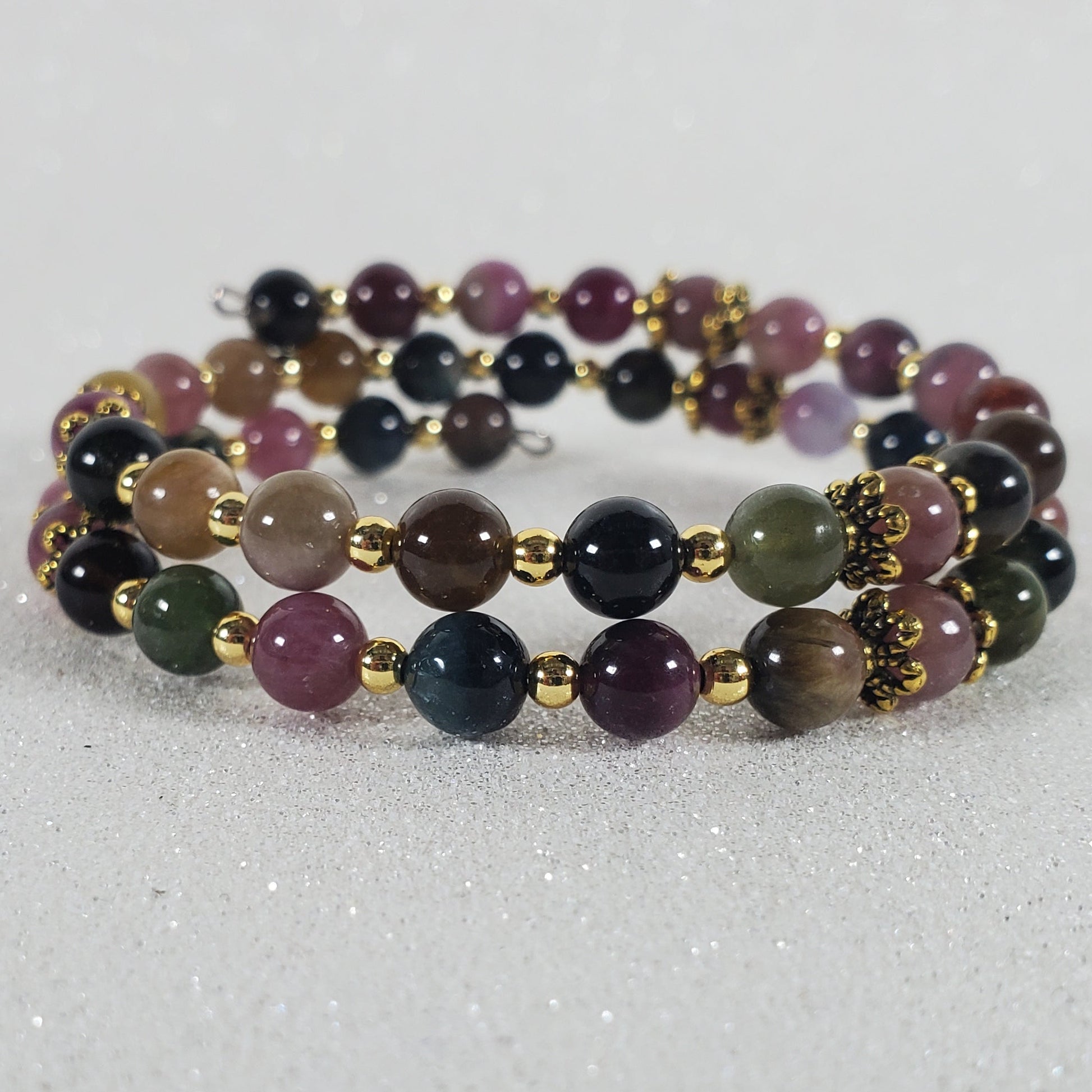 Multicolored beaded bracelet on a light gray background