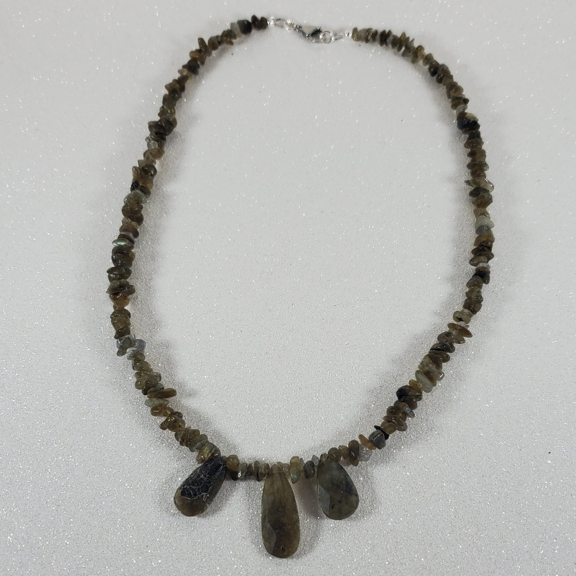 Beaded necklace with a lobster claw clasp on a white background