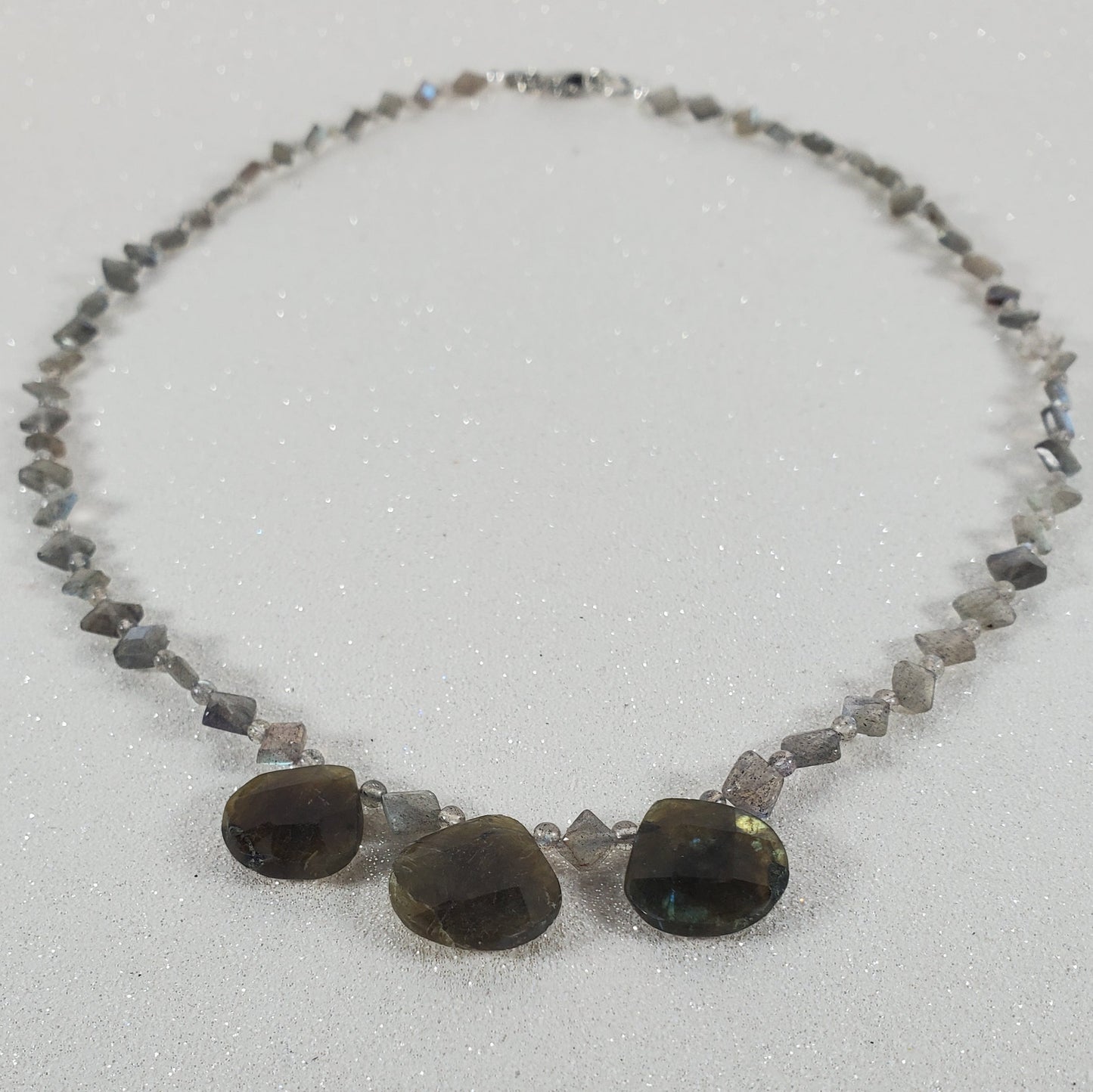 Necklace with stones on a light gray background
