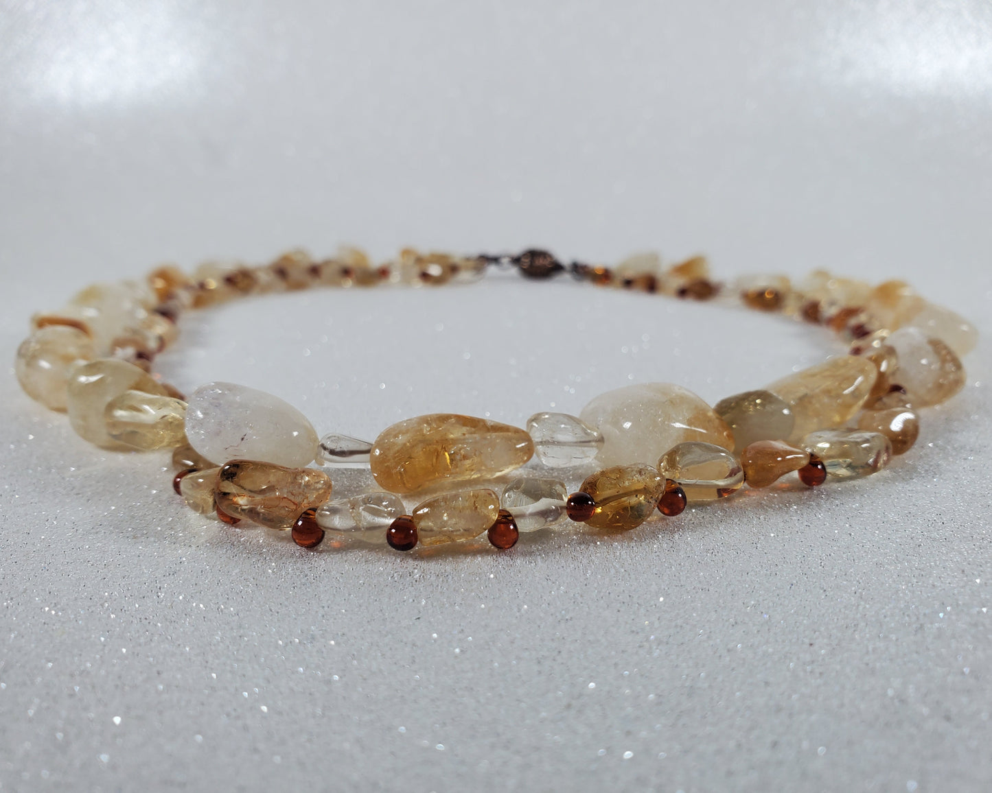 Beaded Necklace with amber and yellow beads on a white background