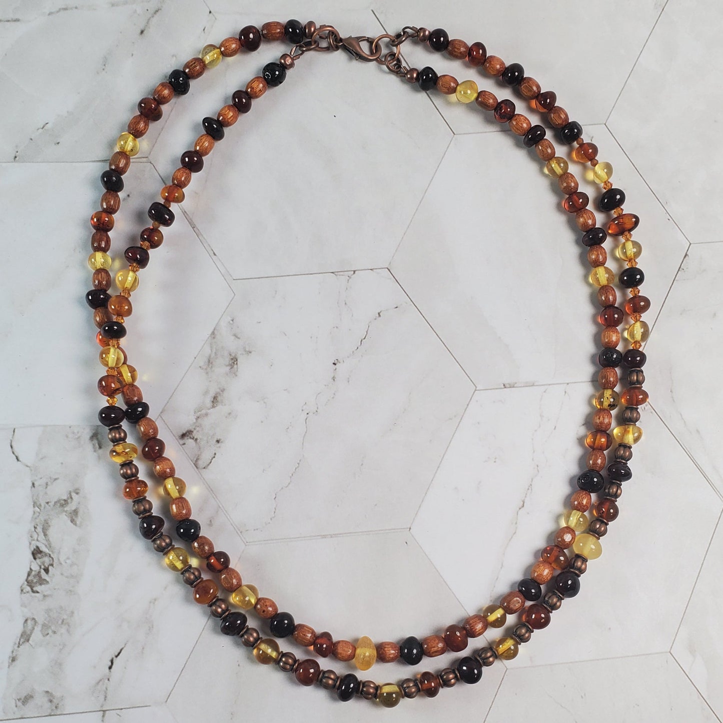 Multicolored beaded necklace on a marble surface