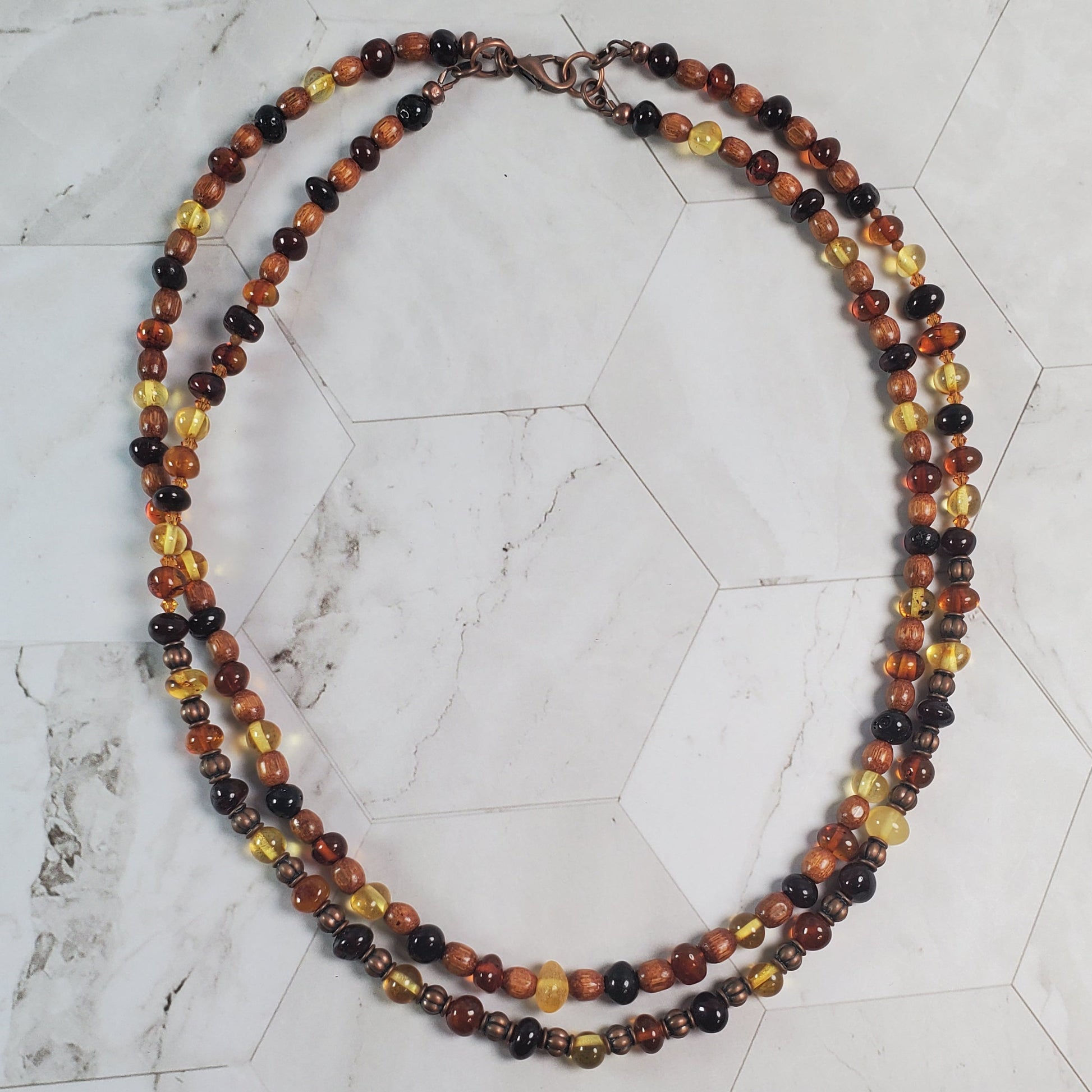 Multicolored beaded necklace on a marble surface