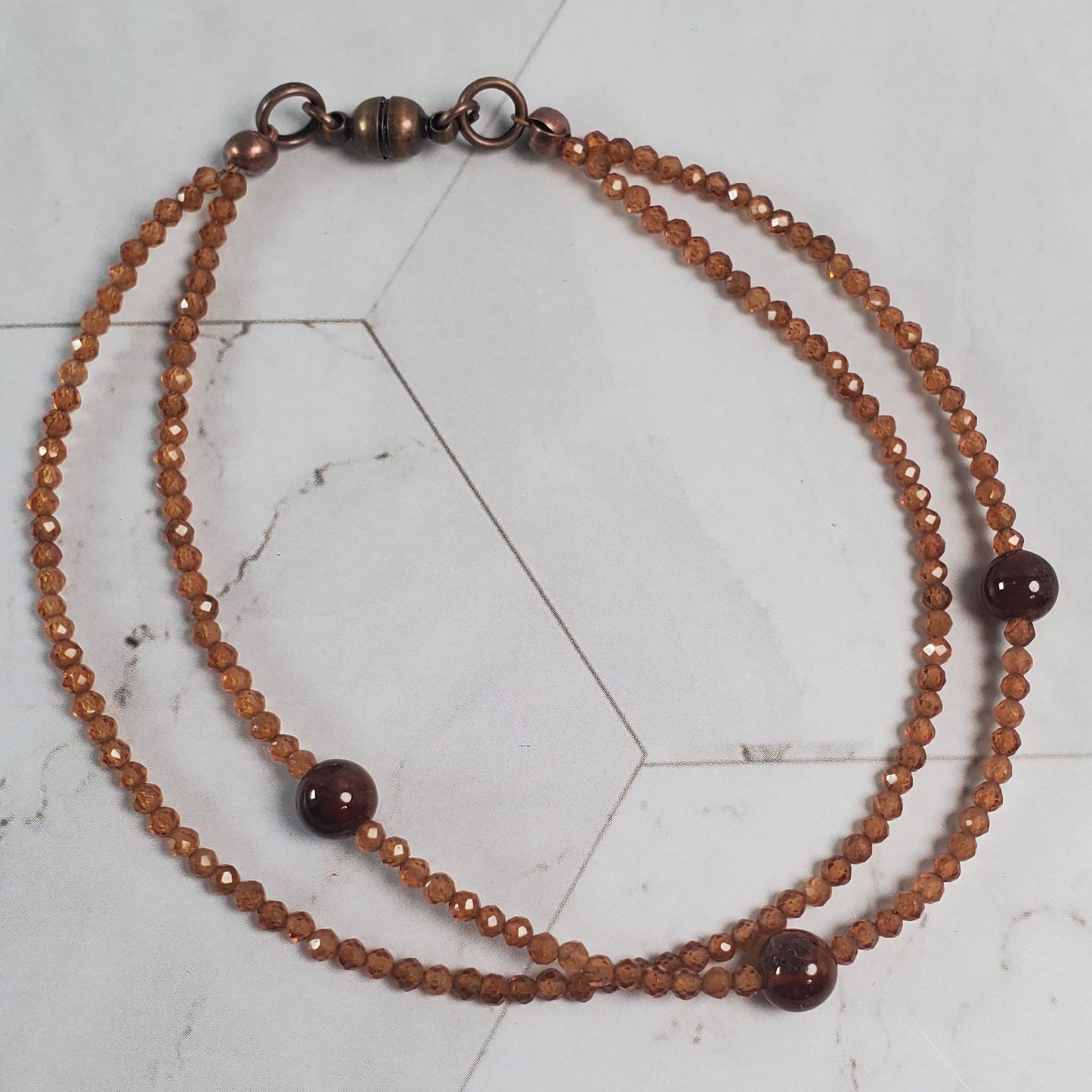 Beaded bracelet on a marble tile