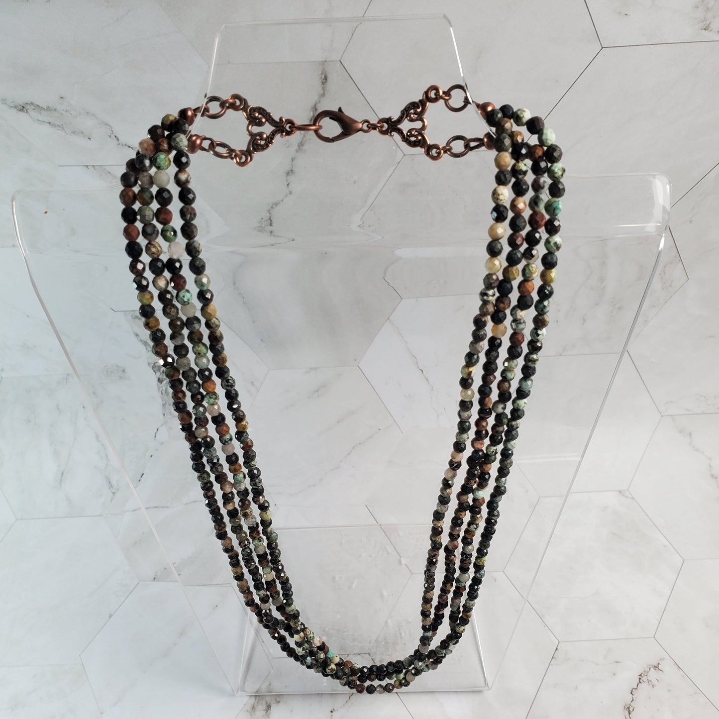 Beaded necklace on a marble surface