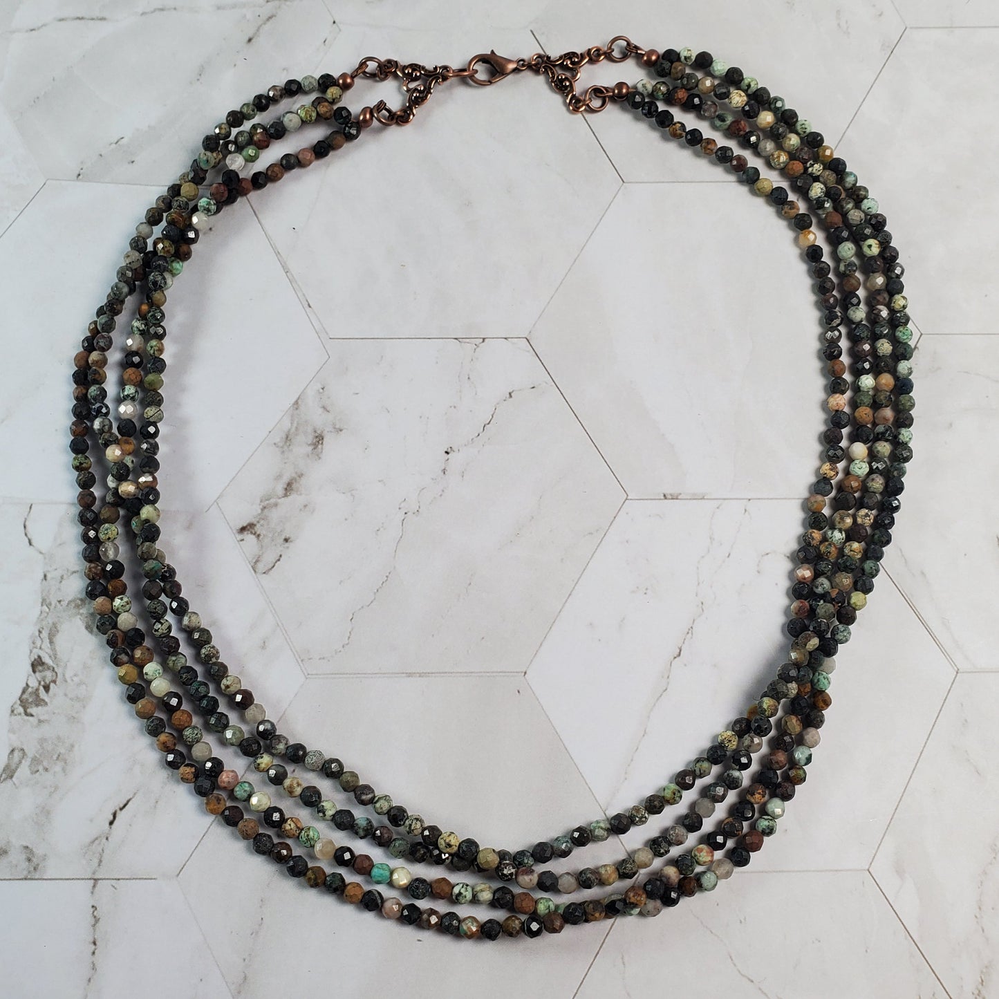 Beaded necklace on a marble surface